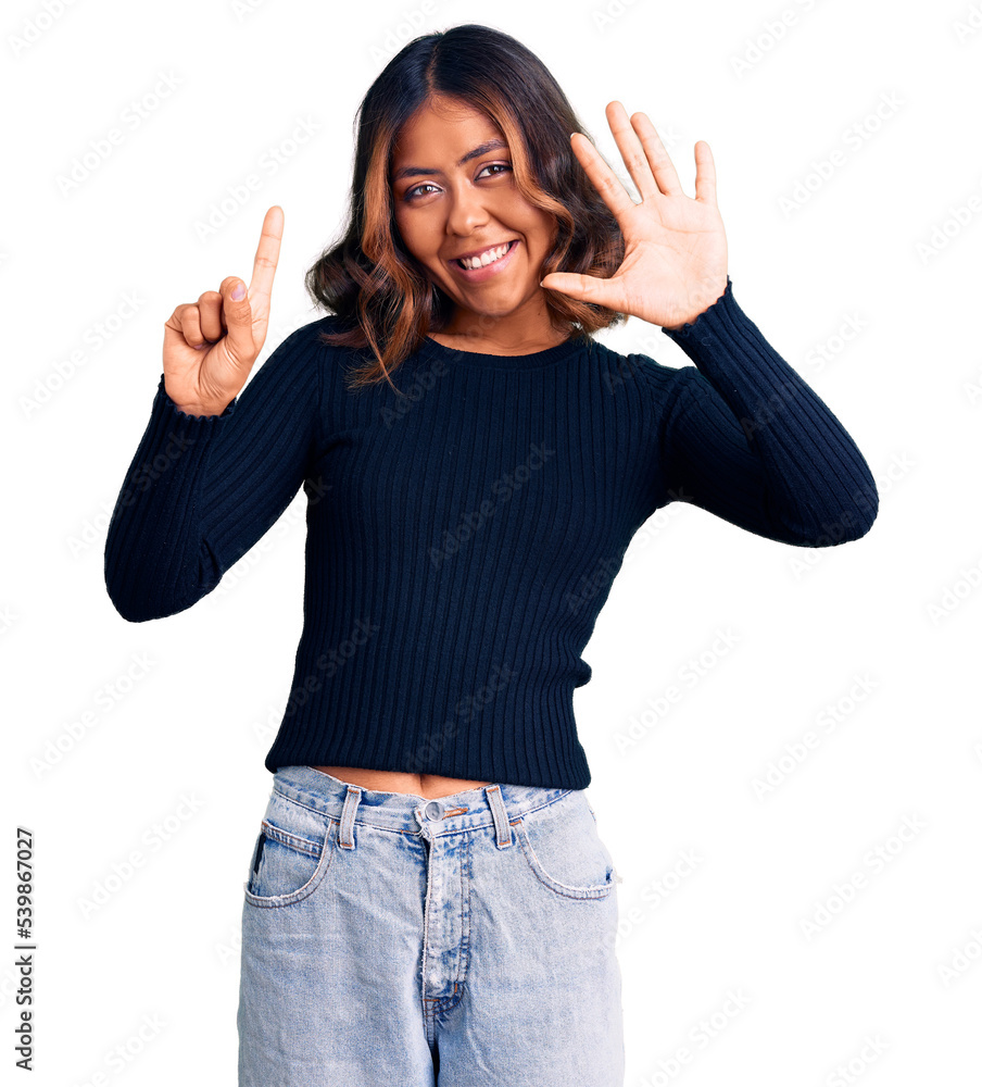 Young beautiful mixed race woman wearing casual clothes showing and pointing up with fingers number six while smiling confident and happy. Young beautiful mixed race woman wearing casual clothes showing and pointing up with fingers number six while smiling confident and happy.