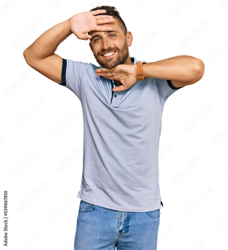 Handsome man with beard wearing casual clothes smiling cheerful playing peek a boo with hands showing face. surprised and exited Handsome man with beard wearing casual clothes smiling cheerful playing peek a boo with hands showing face. surprised and exited