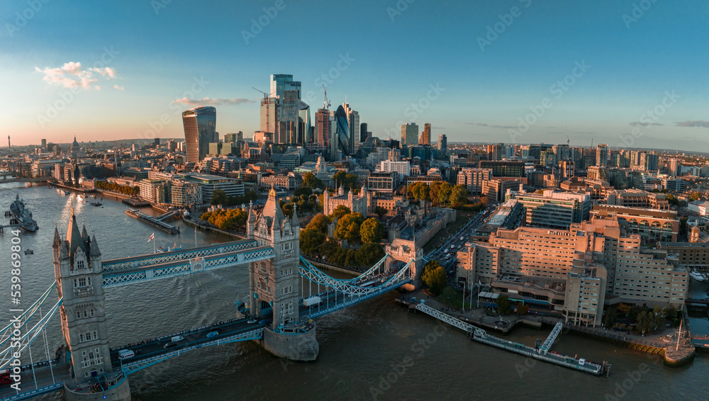 Obraz premium Aerial view of the London Tower Bridge at sunset. Sunset with beautiful clouds over London - the capital of Britain.