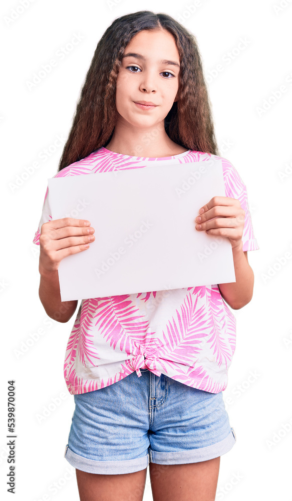 Cute hispanic child girl holding blank empty banner thinking attitude and sober expression looking self confident Cute hispanic child girl holding blank empty banner thinking attitude and sober expression looking self confident