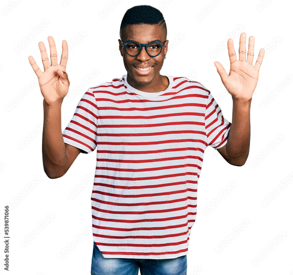 Young african american man wearing casual t shirt and glasses showing and pointing up with fingers number nine while smiling confident and happy. Young african american man wearing casual t shirt and glasses showing and pointing up with fingers number nine while smiling confident and happy.