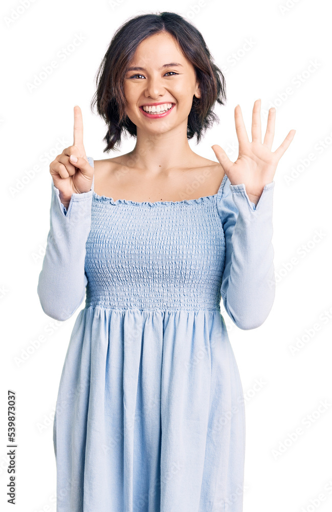 Young beautiful girl wearing casual clothes showing and pointing up with fingers number six while smiling confident and happy. Young beautiful girl wearing casual clothes showing and pointing up with fingers number six while smiling confident and happy.