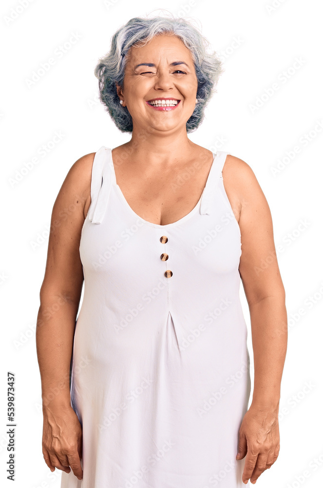 Senior woman with gray hair wearing casual clothes winking looking at the camera with sexy expression, cheerful and happy face. Senior woman with gray hair wearing casual clothes winking looking at the camera with sexy expression, cheerful and happy face.