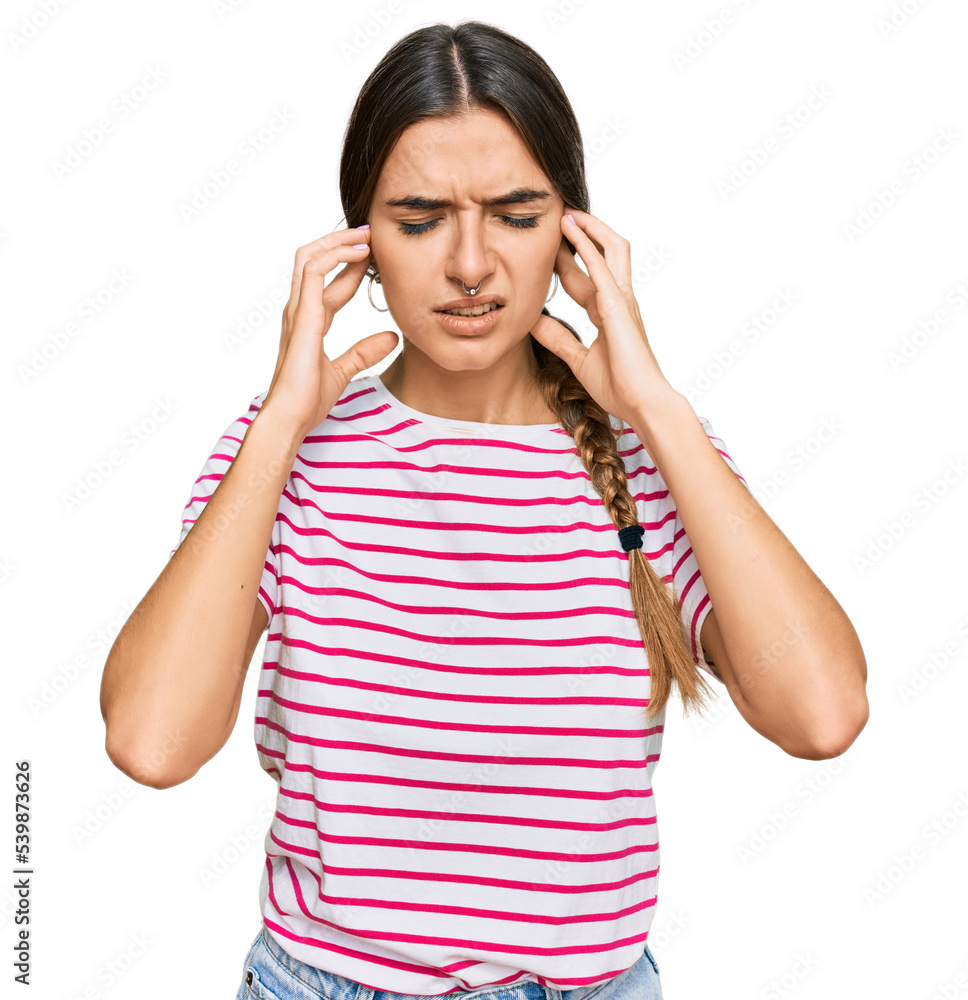Young hispanic woman wearing casual clothes covering ears with fingers with annoyed expression for the noise of loud music. deaf concept. Young hispanic woman wearing casual clothes covering ears with fingers with annoyed expression for the noise of loud music. deaf concept.