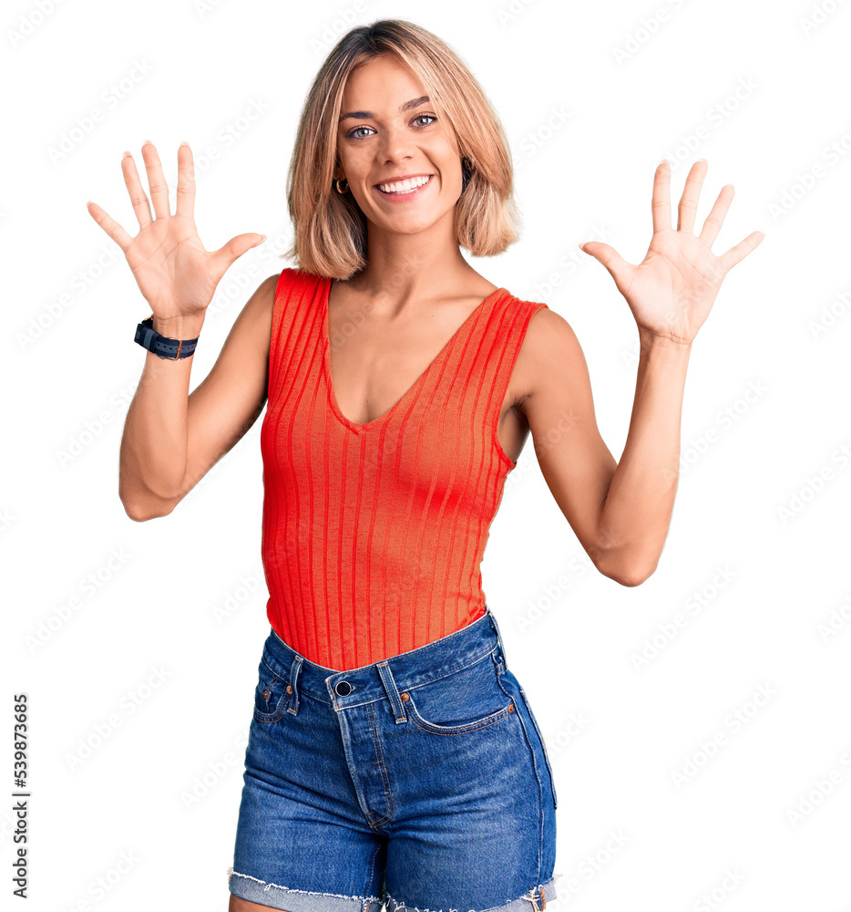 Beautiful caucasian woman wearing casual clothes showing and pointing up with fingers number ten while smiling confident and happy. Beautiful caucasian woman wearing casual clothes showing and pointing up with fingers number ten while smiling confident and happy.