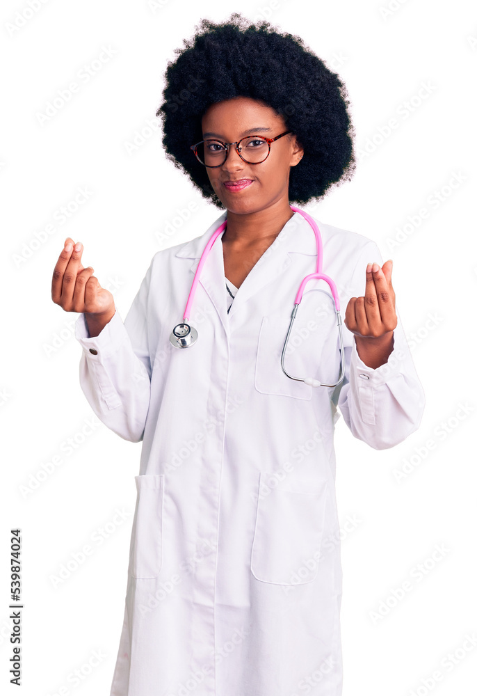 Young african american woman wearing doctor coat and stethoscope doing money gesture with hands, asking for salary payment, millionaire business