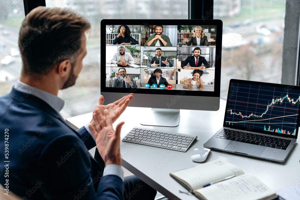 Confident successful businessman, company boss, stock investor, having financial brainstorm with group of multiracial people by video conference, discuss investments in the stock market, risks - obrazy, fototapety, plakaty 