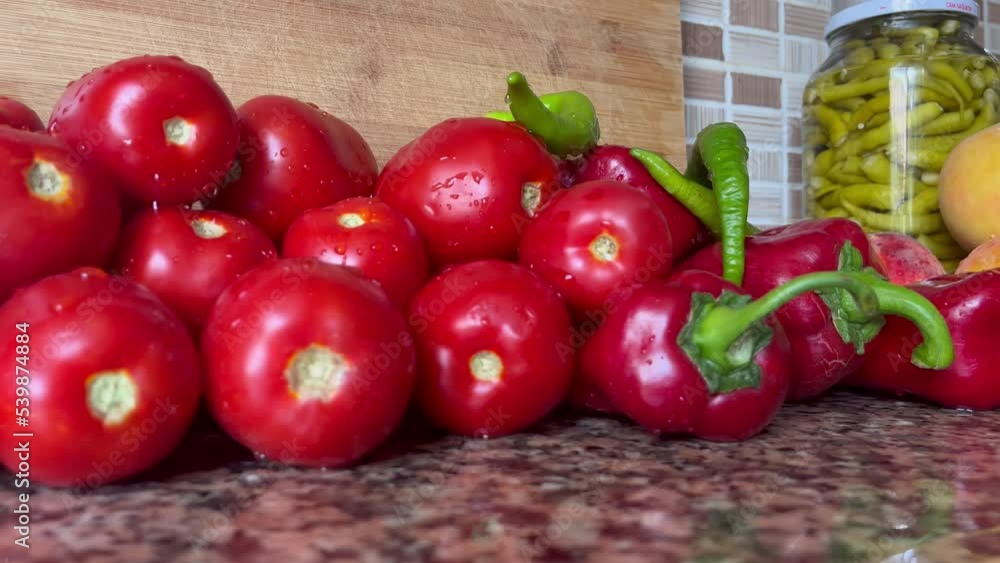 Tomato harvest. Many tomatoes. Excellent tomatoes on the vegetable market stall. Tomatoes on the Market. Background of Tomatoes. Healthy Vegan. Tomato harvest. Many tomatoes. Excellent tomatoes on the vegetable market stall. Tomatoes on the Market. Background of Tomatoes. Healthy Vegan.