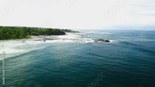 An ocean next to a Playa Junquillal beach in Costa Rica photo