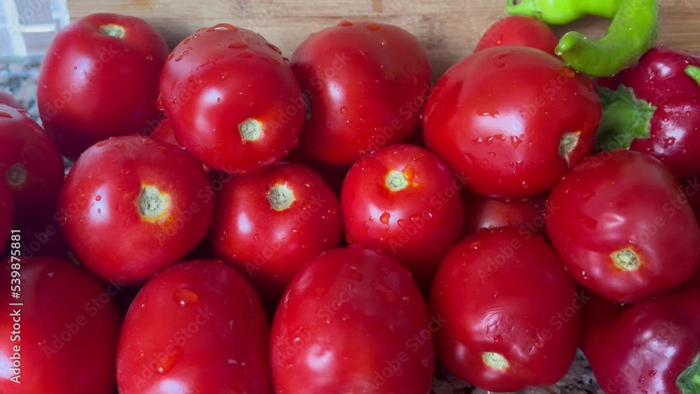 Tomato harvest. Many tomatoes. Excellent tomatoes on the vegetable market stall. Tomatoes on the Market. Background of Tomatoes. Healthy Vegan. Tomato harvest. Many tomatoes. Excellent tomatoes on the vegetable market stall. Tomatoes on the Market. Background of Tomatoes. Healthy Vegan.