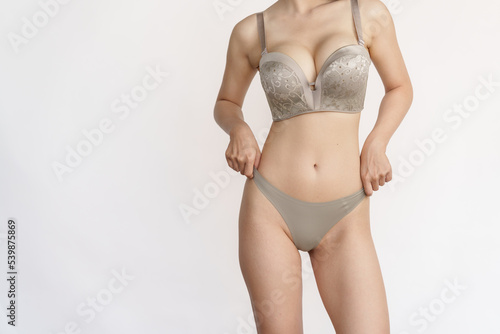 Skinny style underwear asian women wearing lingerie showing sexy body and beauty perfect skin. Women underwear high-waist panties and healthcare concept.