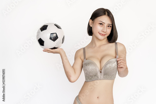 Fototapeta Naklejka Na Ścianę i Meble -  Sexy asian woman slim perfect body with a soccer ball on white background.
