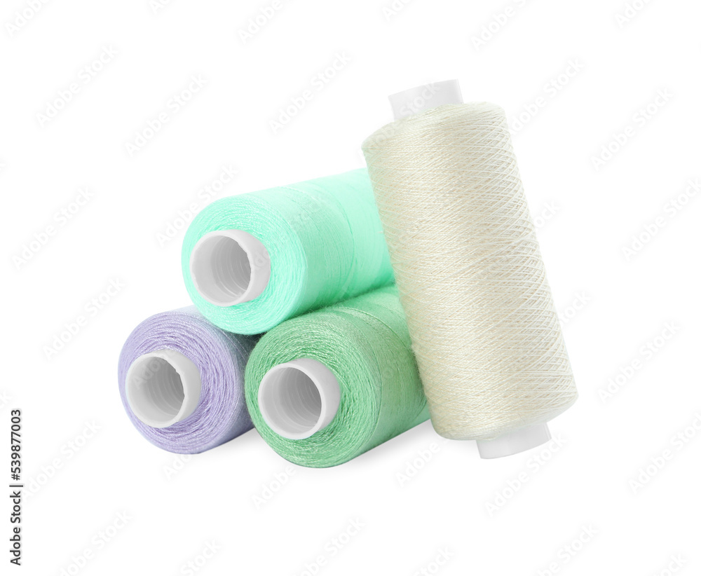Obraz premium Different colorful sewing threads on white background