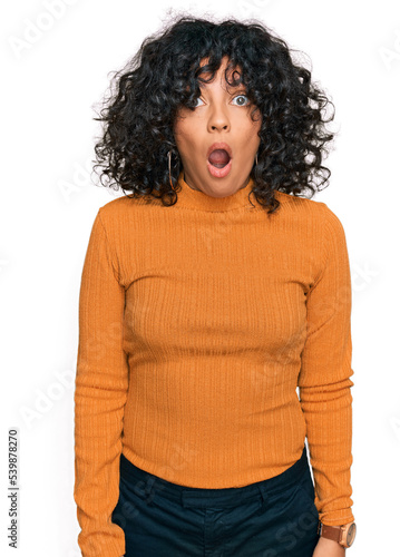 Young hispanic woman wearing casual clothes afraid and shocked with surprise and amazed expression, fear and excited face.