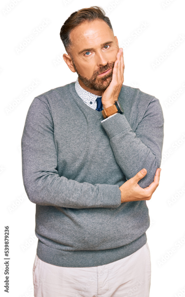 © Krakenimages.com - Handsome middle age man wearing business clothes thinking looking tired and bored with depression problems with crossed arms. © Krakenimages.com - Handsome middle age man wearing business clothes thinking looking tired and bored with depression problems with crossed arms.