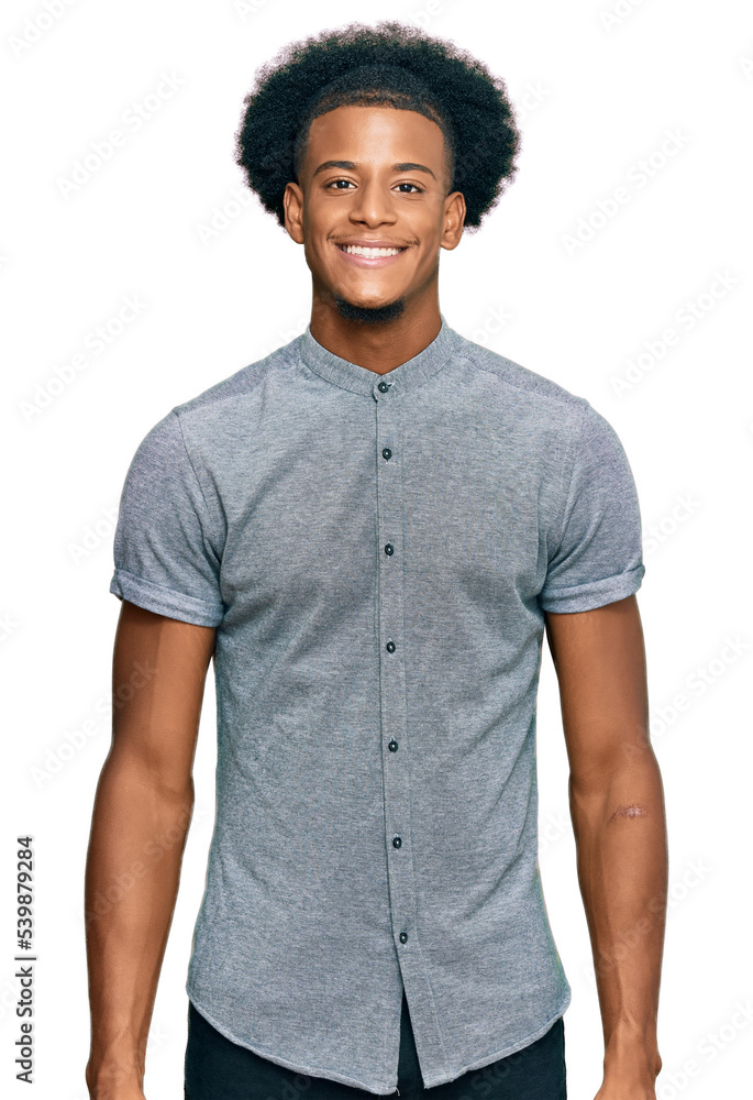 African american man with afro hair wearing casual clothes with a happy and cool smile on face. lucky person. African american man with afro hair wearing casual clothes with a happy and cool smile on face. lucky person.