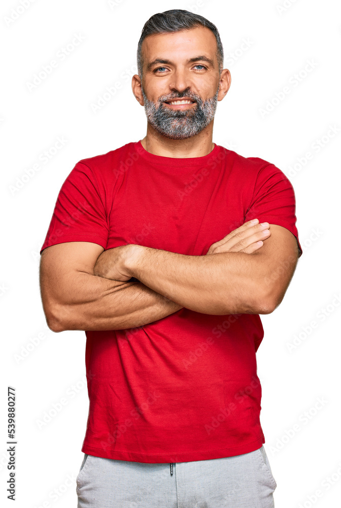 Middle age handsome man wearing casual clothes happy face smiling with crossed arms looking at the camera. positive person. Middle age handsome man wearing casual clothes happy face smiling with crossed arms looking at the camera. positive person.