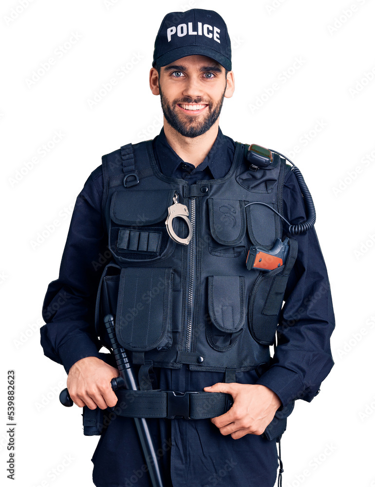 Young handsome man with beard wearing police uniform with a happy and cool smile on face. lucky person. Young handsome man with beard wearing police uniform with a happy and cool smile on face. lucky person.