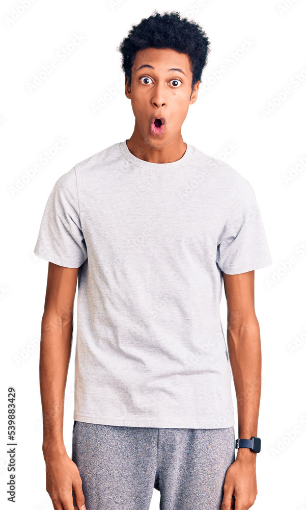Fototapeta premium Young african american man wearing casual clothes afraid and shocked with surprise expression, fear and excited face.