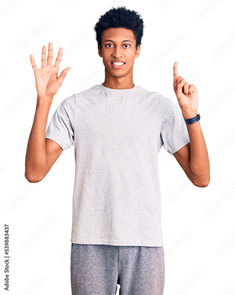 Young african american man wearing casual clothes showing and pointing up with fingers number six while smiling confident and happy. Young african american man wearing casual clothes showing and pointing up with fingers number six while smiling confident and happy.