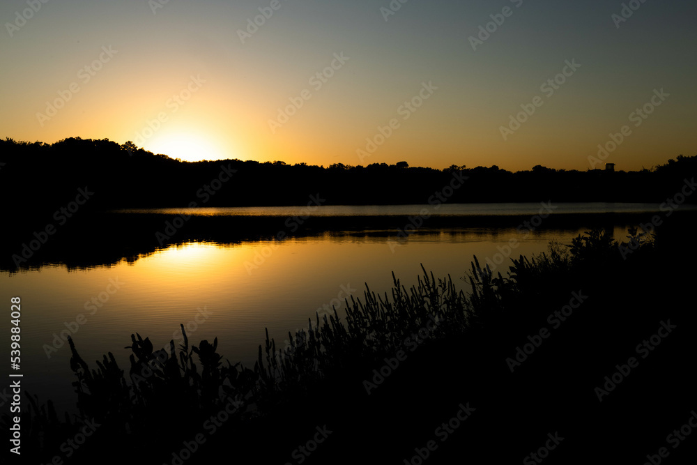 Obraz premium sunset over the river
