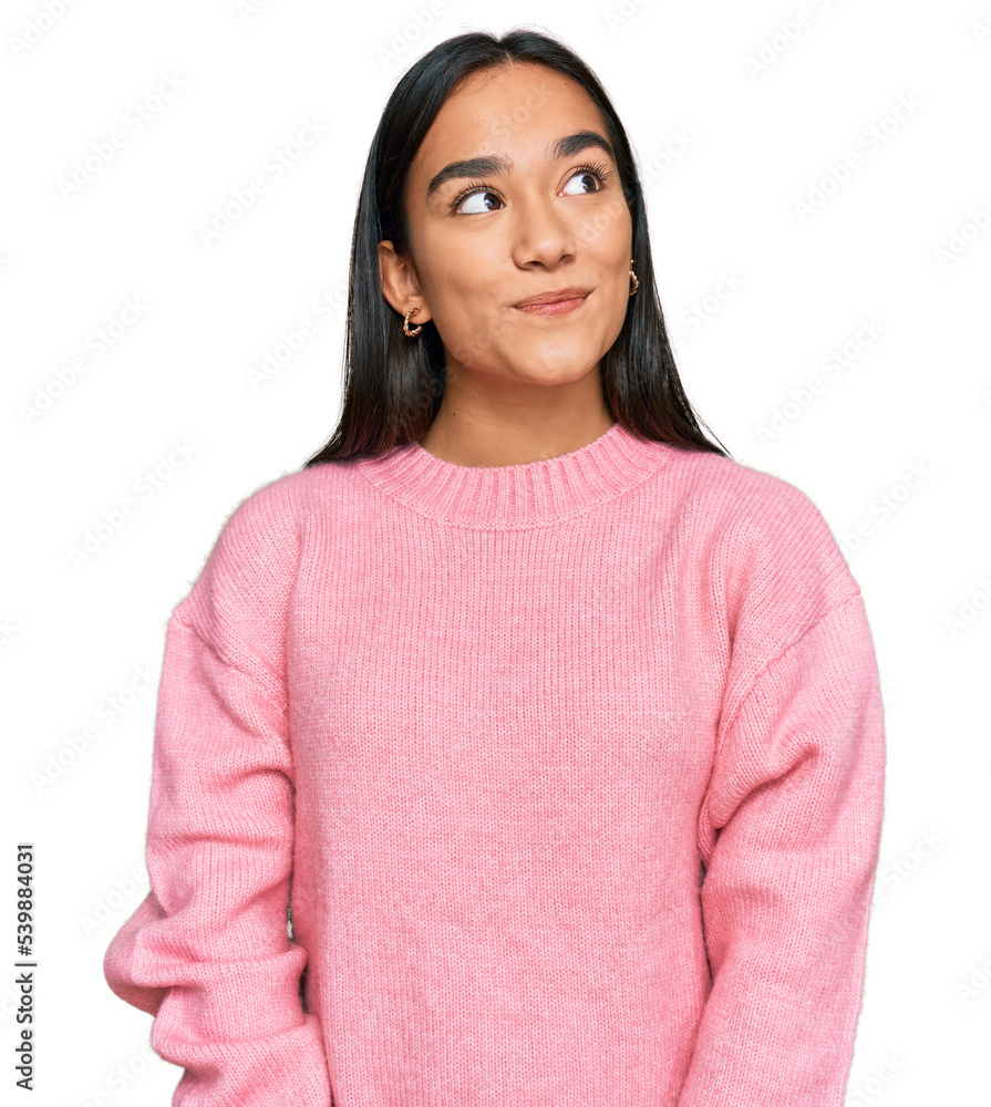 Young asian woman wearing casual winter sweater smiling looking to the side and staring away thinking. - obrazy, fototapety, plakaty 