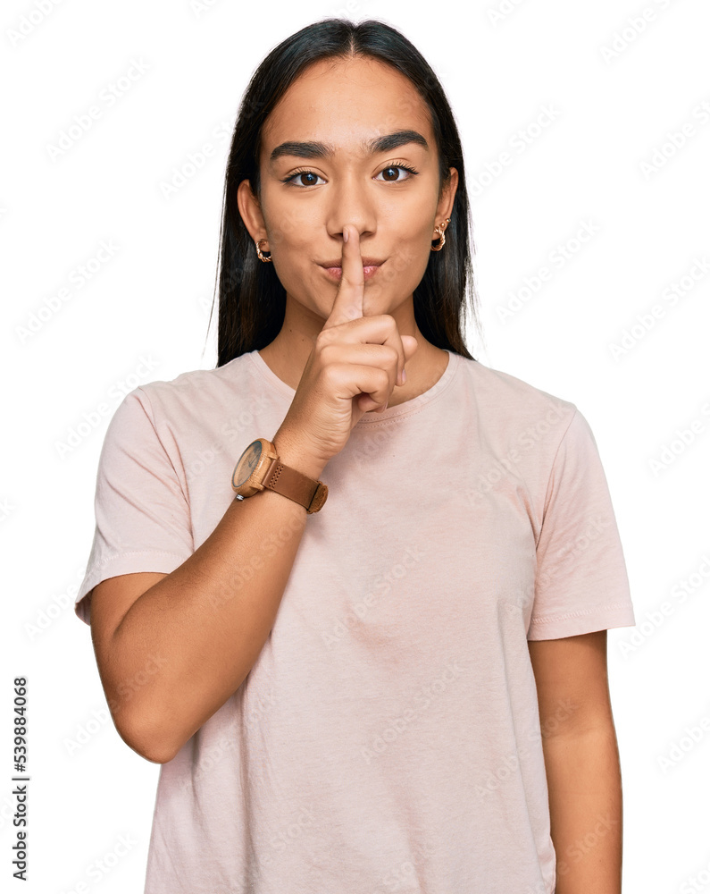 Young asian woman wearing casual clothes asking to be quiet with finger on lips. silence and secret concept. Young asian woman wearing casual clothes asking to be quiet with finger on lips. silence and secret concept.