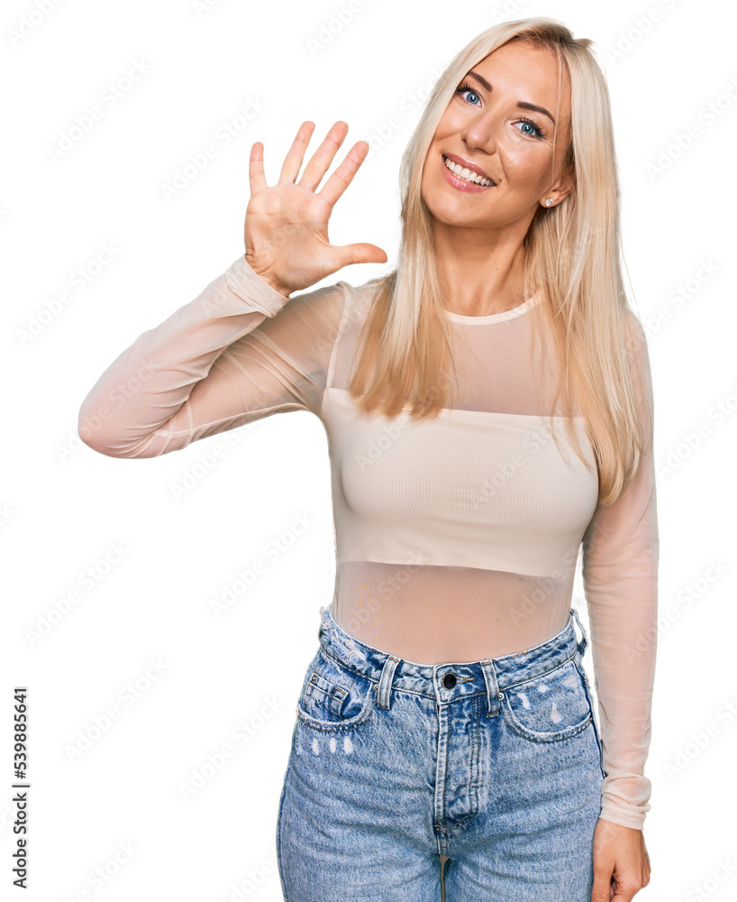 Young blonde woman wearing casual clothes showing and pointing up with fingers number five while smiling confident and happy. Young blonde woman wearing casual clothes showing and pointing up with fingers number five while smiling confident and happy.