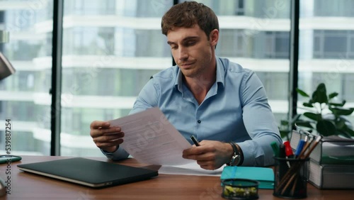 Exhausted businessman taking documents reading unsatisfied information close up.