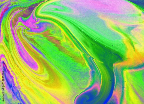 Abstract background of pink-green marble. Acrylic paint spreads freely and creates an interesting pattern. Background for the cover of a laptop  notebook.