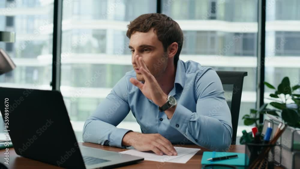 Man saying goodbye video call sending air kiss at office laptop close up. Man saying goodbye video call sending air kiss at office laptop close up.