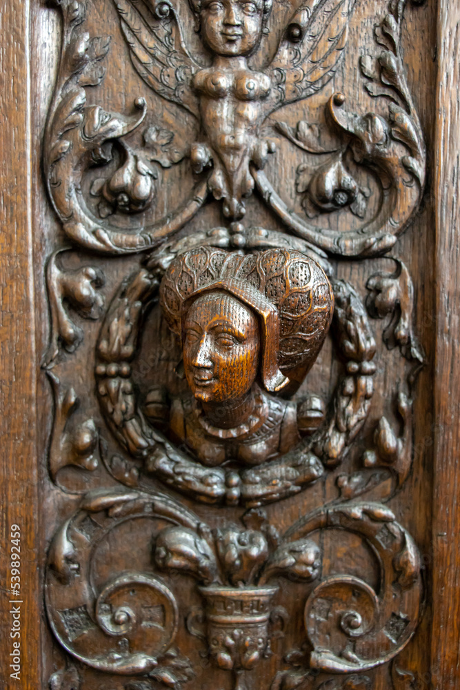 Carved decoration on the wall of a cabinet from the 16th century