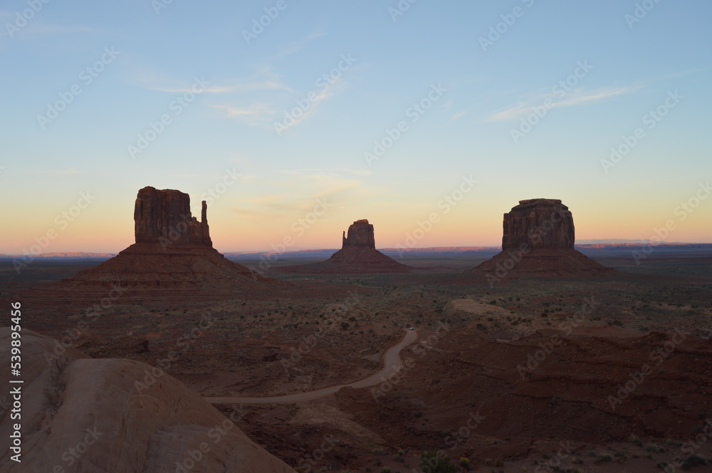 Sunset over the East and West Mitten Buttes at Monument Valley, Utah