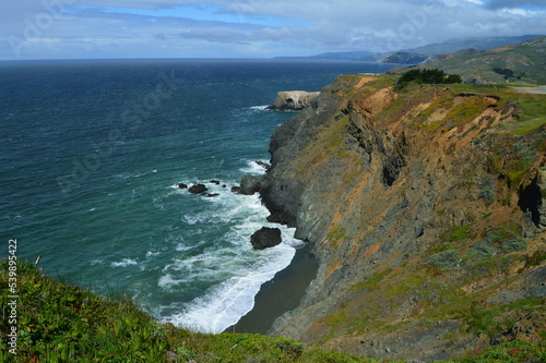 Sea cliffs and black sand beach along the California coast north of San Francisco. 