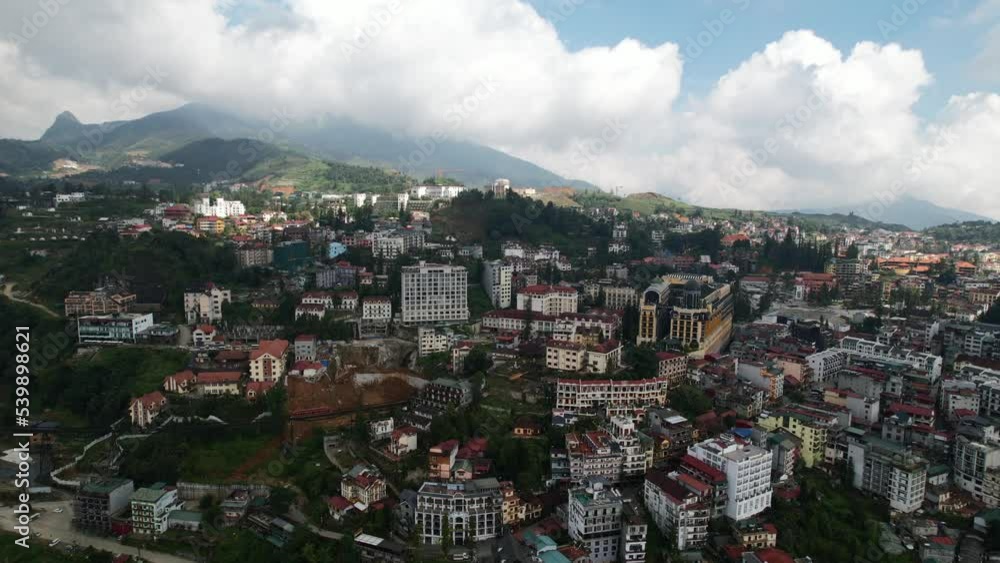 aerial of hotels in Sapa town on mountain hill in Vietnam on a sunny summer day Lao Cai Province aerial of hotels in Sapa town on mountain hill in Vietnam on a sunny summer day Lao Cai Province