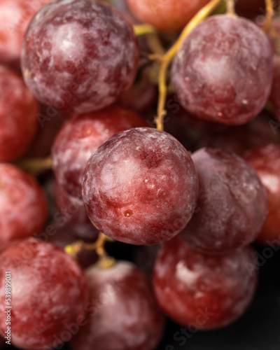 Harvest of ripe, juicy, red grapes with large berries close-up
