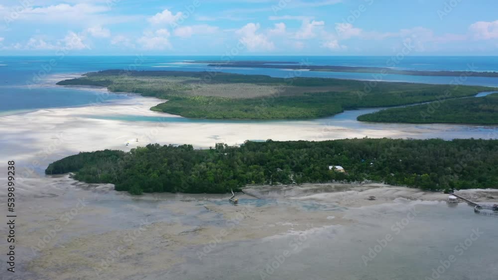 aerial landscape panning right of Leebong island in Belitung Indonesia at extreme low tide on tropical sunny day aerial landscape panning right of Leebong island in Belitung Indonesia at extreme low tide on tropical sunny day