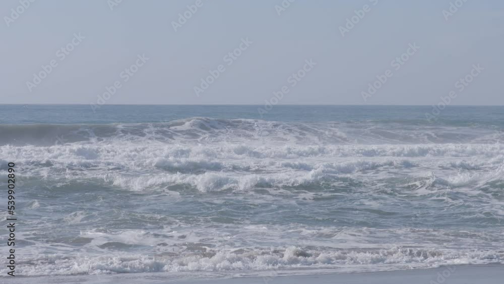 Slow motion shot of waves crashing along the beach of Marina State Beach Monterey Bay California. Slow motion shot of waves crashing along the beach of Marina State Beach Monterey Bay California.