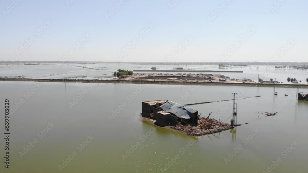 Aerial View Of Flooded Landscape In Pakistan With View Of Makeshift Tent. Parallax Shot Aerial View Of Flooded Landscape In Pakistan With View Of Makeshift Tent. Parallax Shot