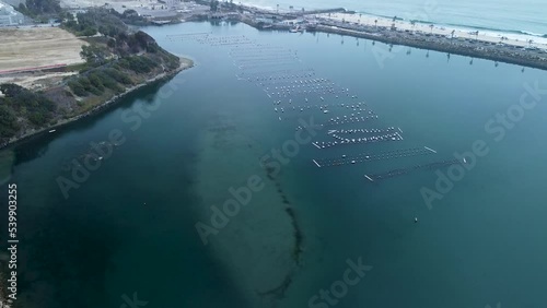 slow pan up Carlsbad lagoon and oyster farm, drone view photo