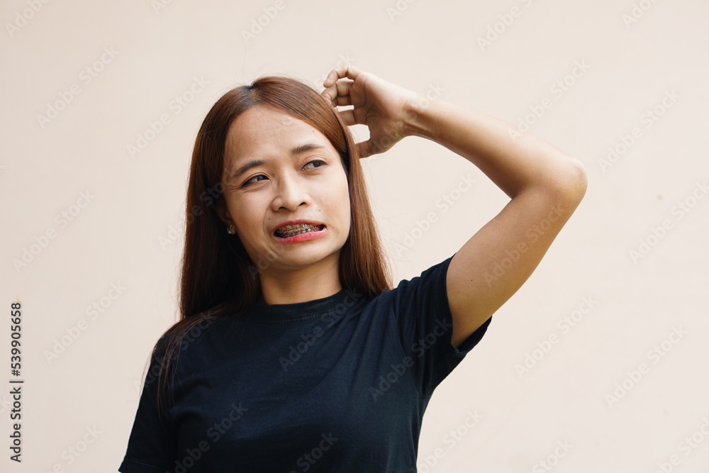 woman has itching on her head. woman has itching on her head.