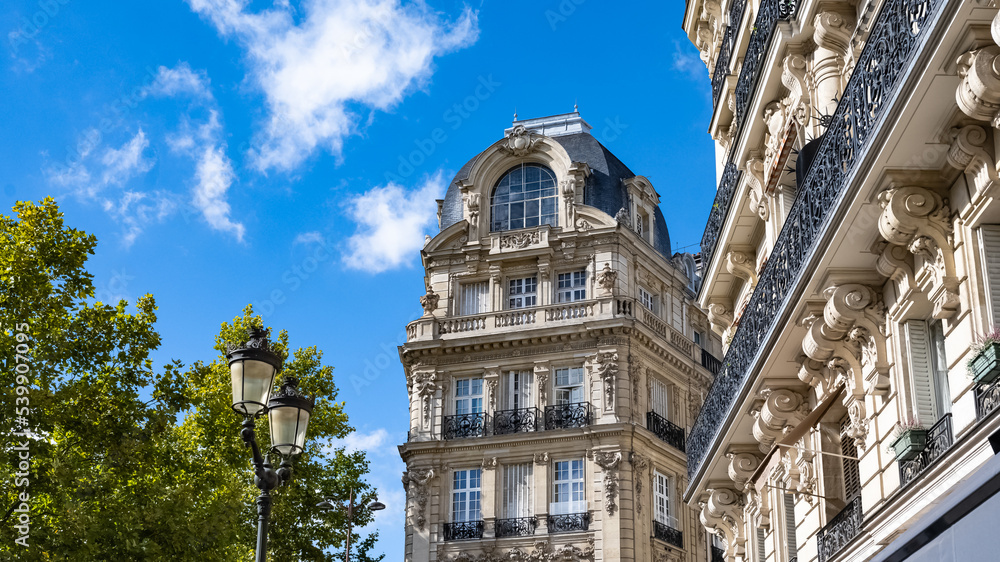 Paris, beautiful building in a luxury neighborhood, typical Haussmann facades
