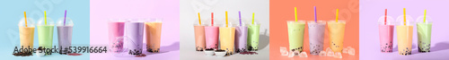 Set of tasty bubble tea in plastic cups on color background