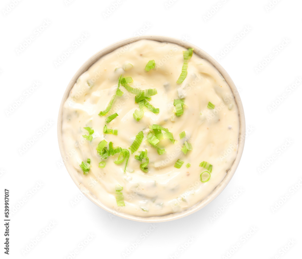 Bowl of tasty Caesar sauce with greens on white background Bowl of tasty Caesar sauce with greens on white background