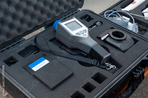 Customer hand holding personal pro dosimeter-radiometers for measuring levels of radiation