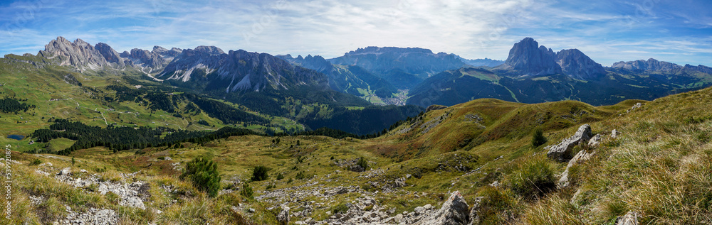 Awesome panoramic mountain view in the dolomites: Distinctive Sassolungo mountain group at gardena valley in south tyrol. View from Piz Pic mountain to sella group and Alp di Siusi. Nature concept