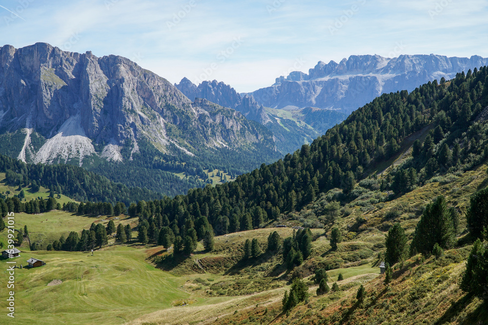 Awesome view to distinctive mountain Sella Group in the Dolomites: World famous mountain ridge in south tyrol, gardena valley, italy. Perfect hiking day with a blue sky