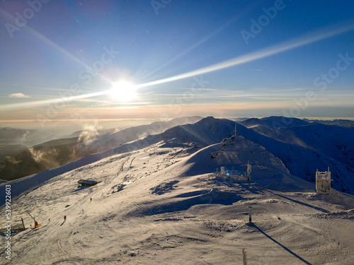 sunset above ski slope in Slovakia tatra mountains © phpetrunina14