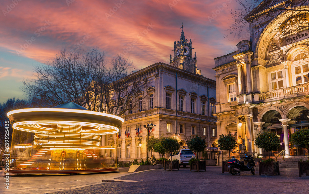 One evening Place de l'Horloge and its merry-go-round, in Avignon, Provence, France