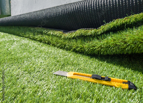 Artificial turf installation with cutting tool